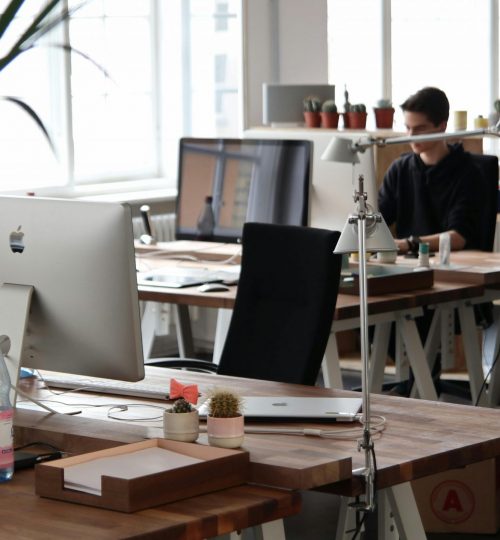 Open-plan office with modern decor and natural lighting, ideal for productivity.